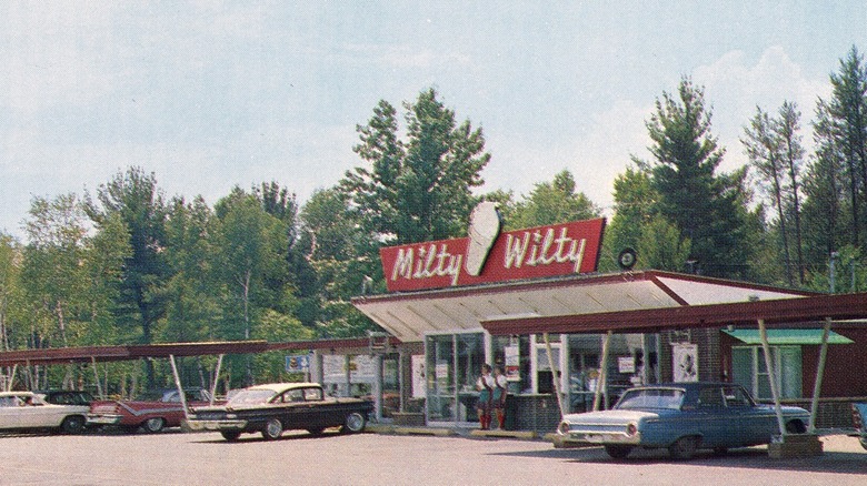 Vintage photo of Milty Wilty drive in with vintage cars parked in parking lot.