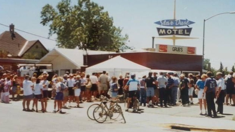 Vintage photo of Grub's Drive In exterior and parking lot filled with a large crowd