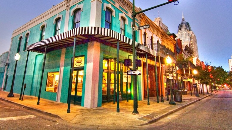 Exterior of Three George's corner candy shop in colorful historic building
