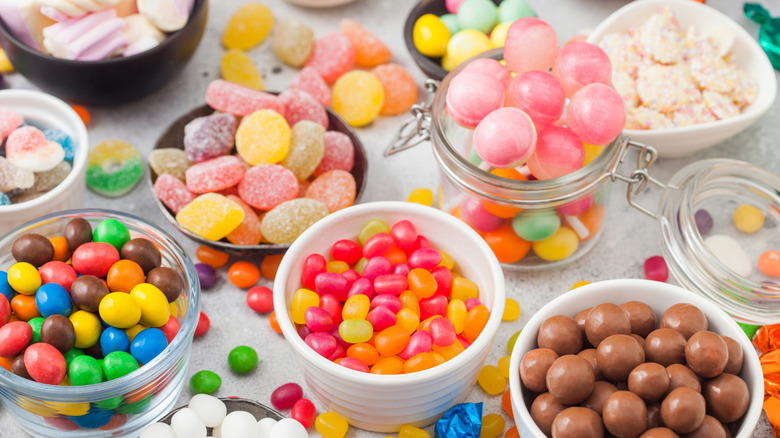 Bowls and jars with colorful, assorted candies