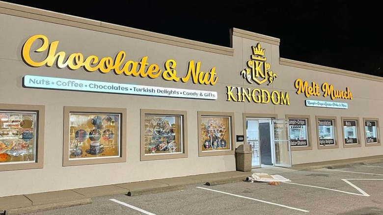 Chocolate and Nut Kingdom storefront at night
