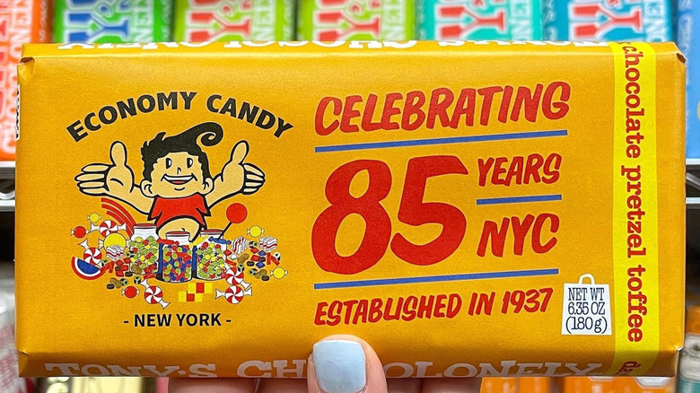 Hand holds Economy Candy celebrating 85 years in New York chocolate bar