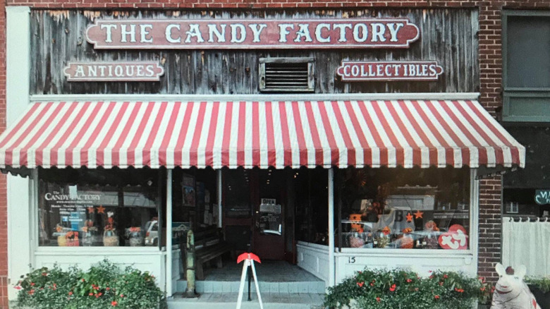 Old-fashioned storefront of The Candy Factory selling antiques and collectibles
