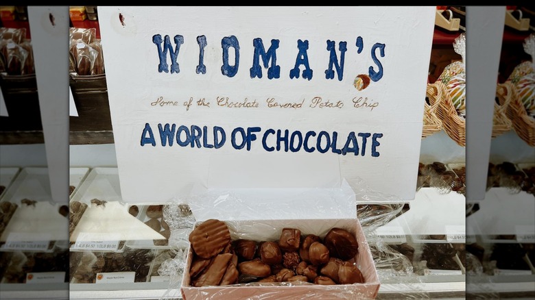 Widman's a world of chocolate sign by box of truffles