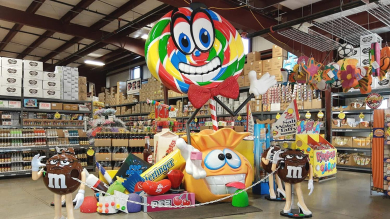 Interior of Sweetie Candy Company warehouse with giant M&M and candy-filled aisles