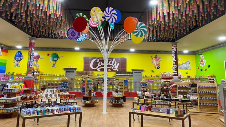 Inside of Rushmore Candy Company with yellow walls and  lollipop tree