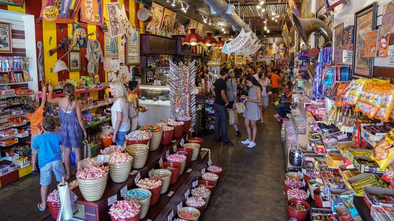 Inside Big Top Candy Shop filled with barrels and walls of candy