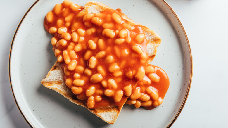 Beans on toast on a white plate