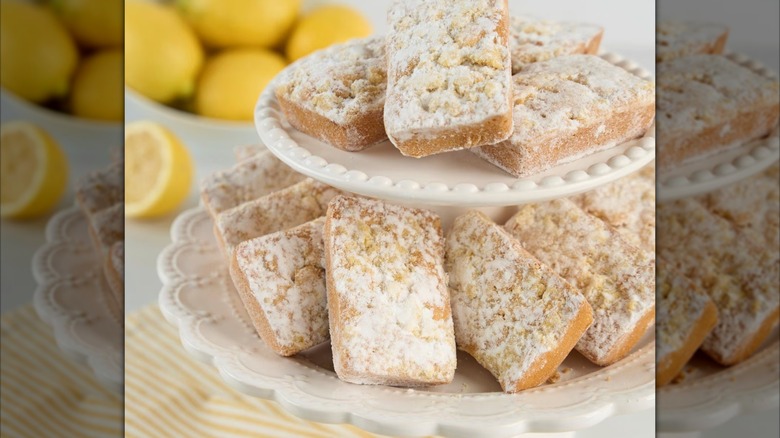 The Member's Mark Lemon Bar Blondies on display next to a pile of lemons