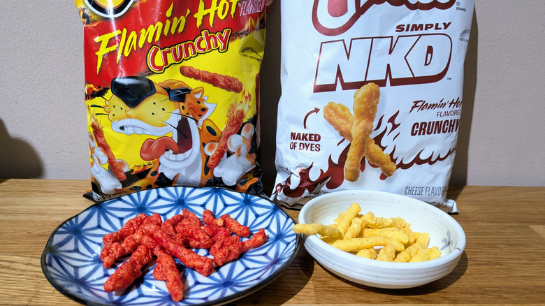 simply nkd flamin' hot cheetos next to regular flamin' hot cheetos
