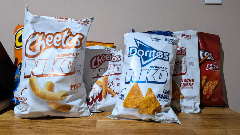 packages of simply nkd and regular frito lays snack packages on counter