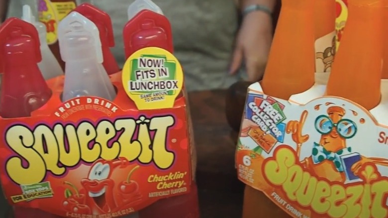 Two cases of Squeezit, flavor cherry and orange.
