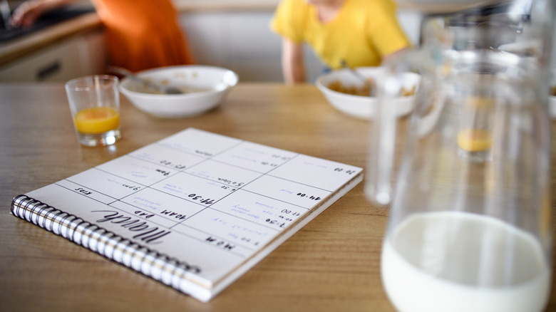 A calendar on a kitchen counter