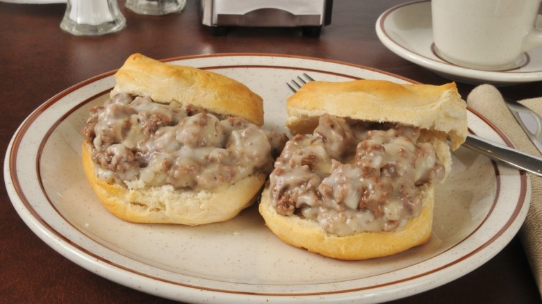 Chipped beef piled on biscuits.