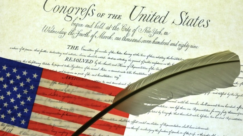An image of the Declaration of Independence with a quill and the American Flag overlaid.