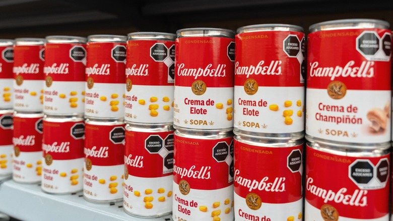 Campbell's soup on a supermarket shelf.