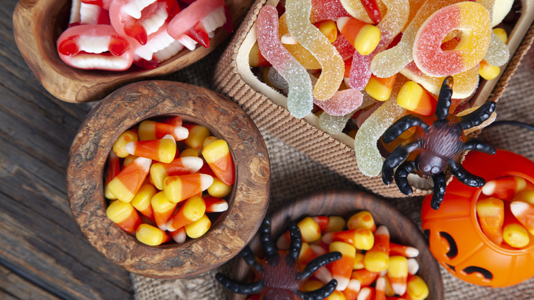Different types of Halloween candy in wooden containers