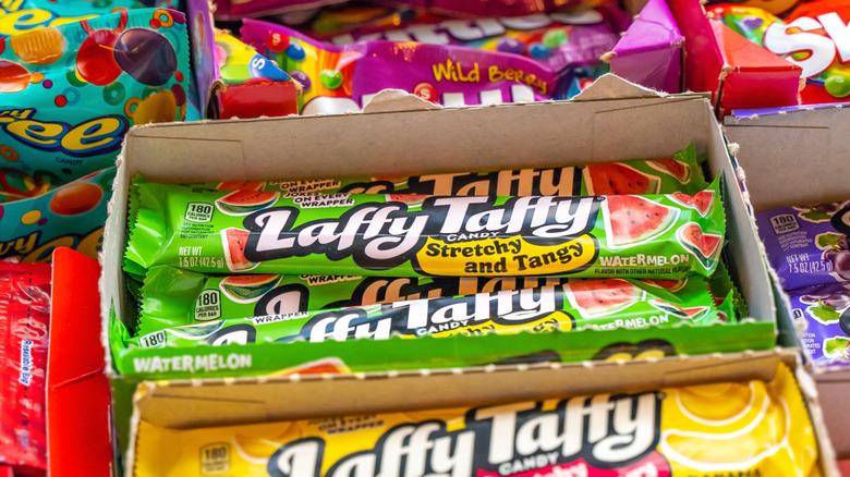 A box of watermelon Laffy Taffy amid other boxes of candy