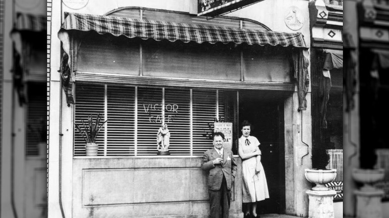 John DiStefano and his wife standing outside The Victor Café.
