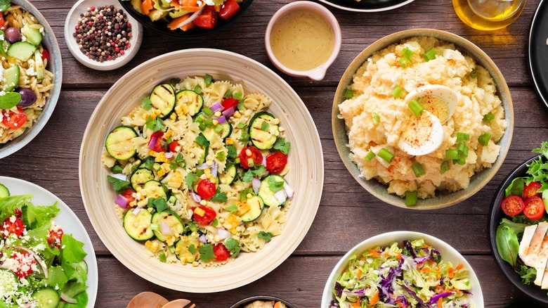 a variety of salads on a table
