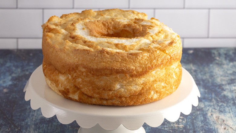 Plain angel food cake on a cake stand