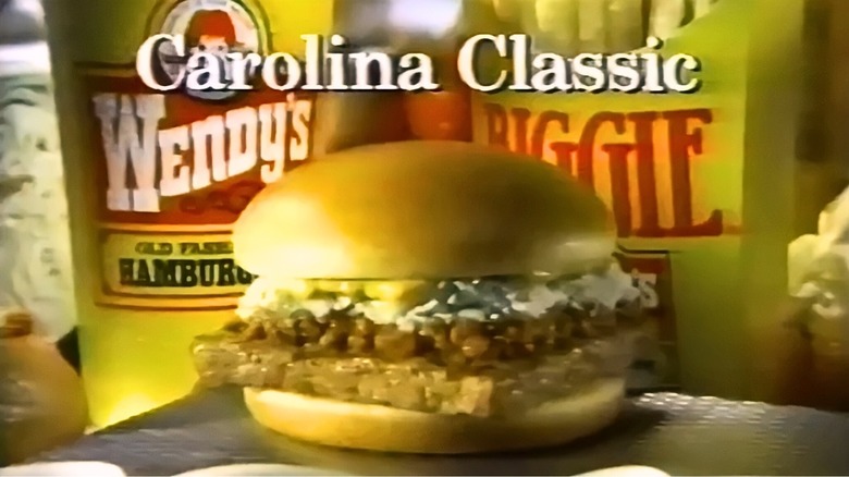 A Wendy's Carolina Classic burger in front of a large fry and drink from the 1990s.