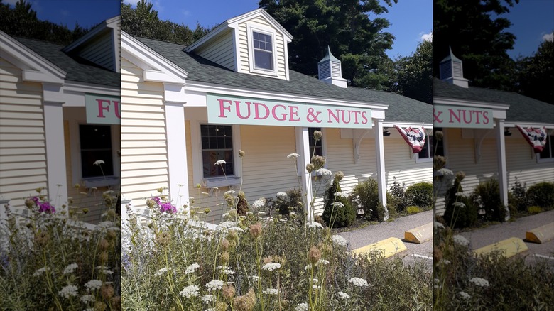 Len Libby Candies exterior with a fudge and nuts sign banner above the front porch entrance