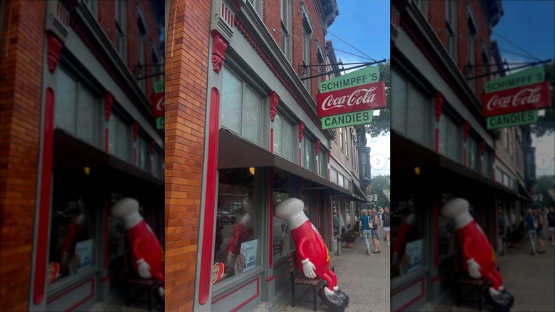 Schimpff's Confectionery exterior with iconic Jelly Bean statue on storefront sidewalk
