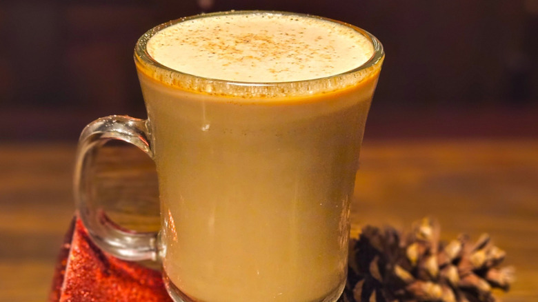 Bryant's Tom and Jerry cocktail in a glass mug with Christmas decorations