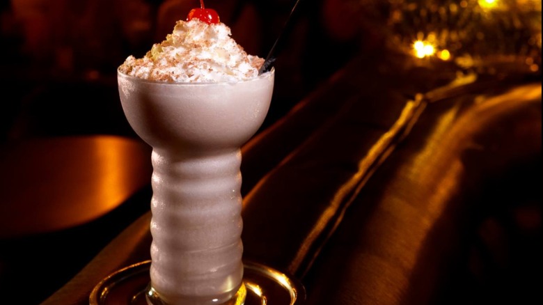 Bryant's Pink Squirrel with whipped cream and maraschino cherry garnish