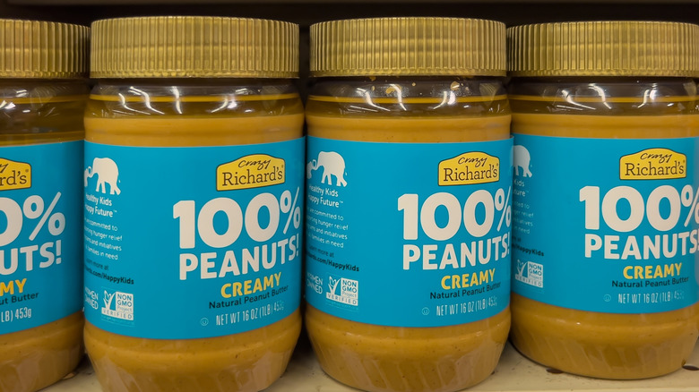 Jars of Crazy Richard's natural peanut butter on a grocery store shelf
