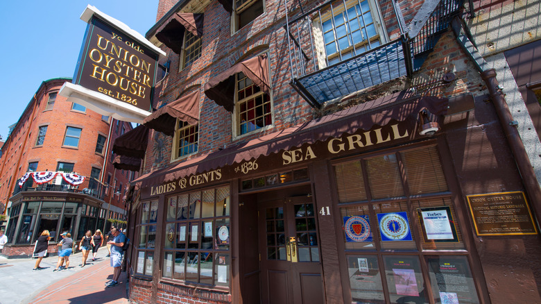The exterior of the old red brick restaurant and the Union Oyster House sign