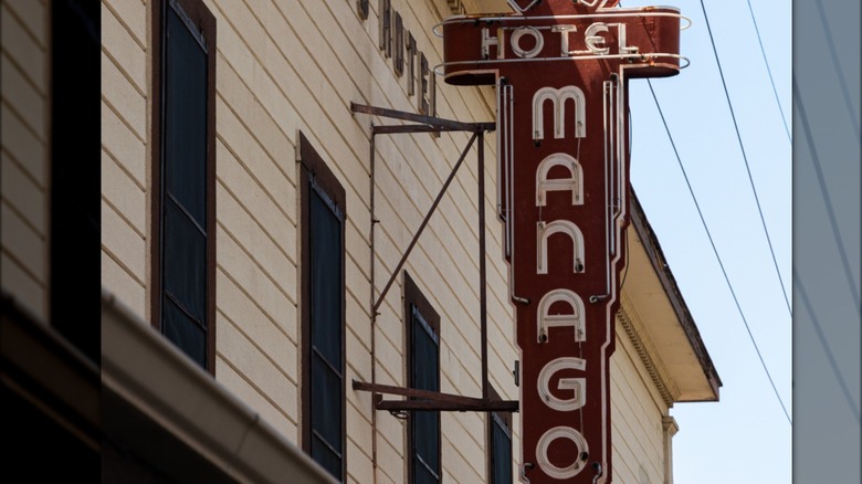 outdoor hanging sign at Hotel Manago in Hawaii