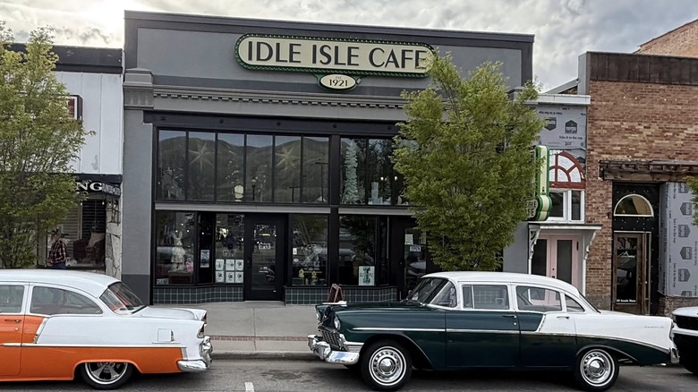 Idle Isle Café exterior with old cars