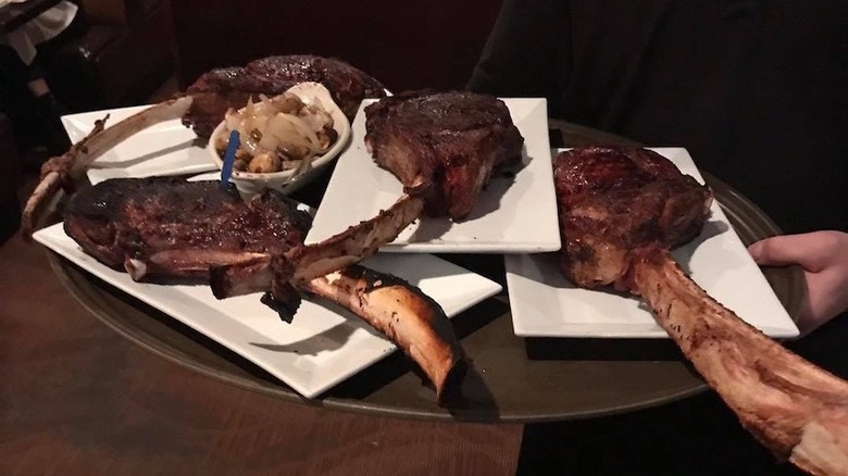 platter of tomahawk steaks at Frank's Steak House