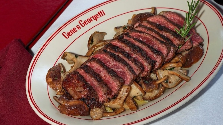 platter of sliced steak and mushrooms at Gene and Georgetti