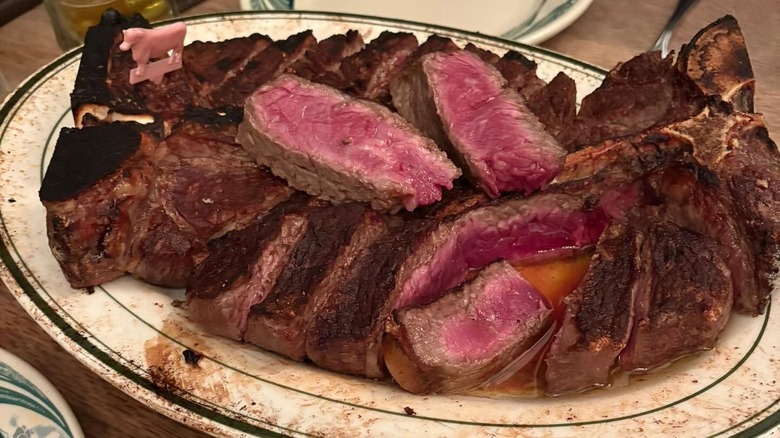 steak on platter at Peter Luger Steak House