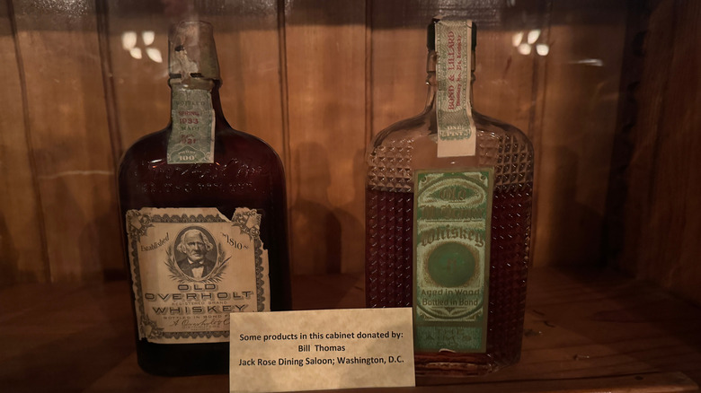 Vintage bottles of Old Overholt and Old McBrayer whiskey