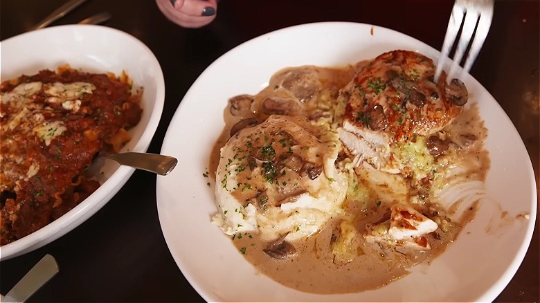 Olive Garden's stuffed chicken marsala served on a white plate