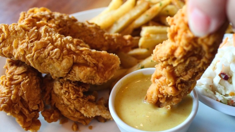 A plate of chicken tenders and fries at Cheddar's Scratch Kitchen.