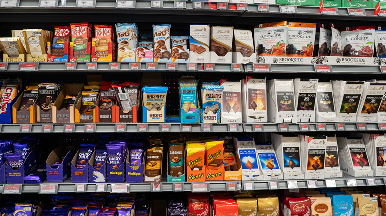 Grocery store display of assorted chocolate bars