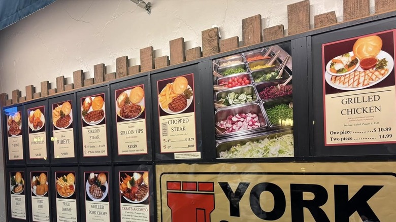 Wall-mounted menu at York Steak House