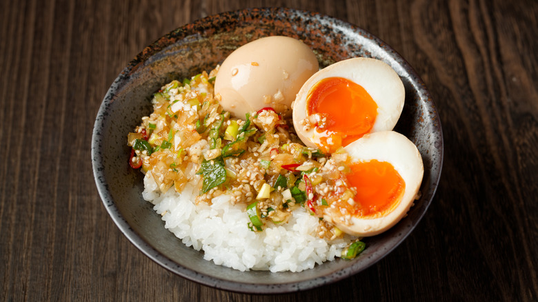 Korean mayak gyeran marinated jammy eggs over bowl of white rice