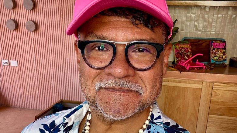 Chef Rick Martinez wearing glasses and a pink hat