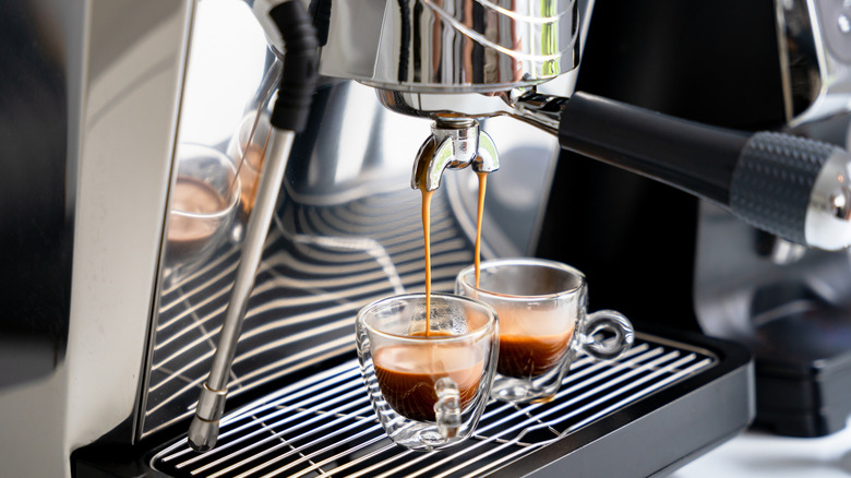 A coffee machine brewing espresso.