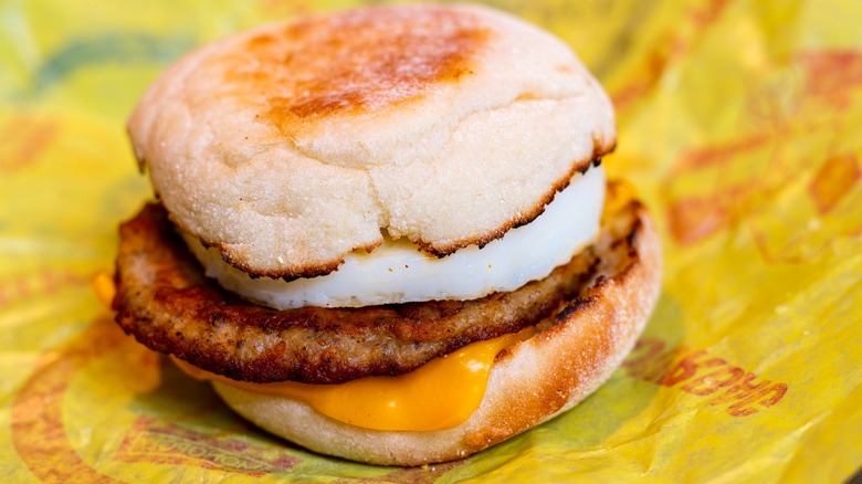 McDonald's Sausage McMuffin sandwich on yellow paper