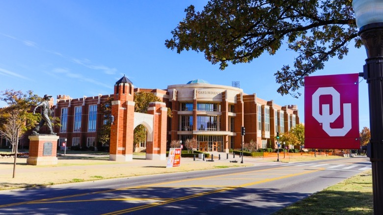 A hall at the University of Oklahoma with a university banner in the foreground.