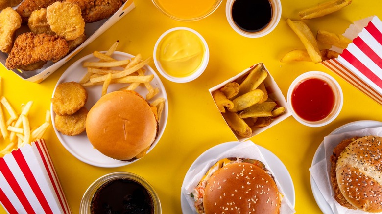 A top-down view of assorted fast food items and sauces