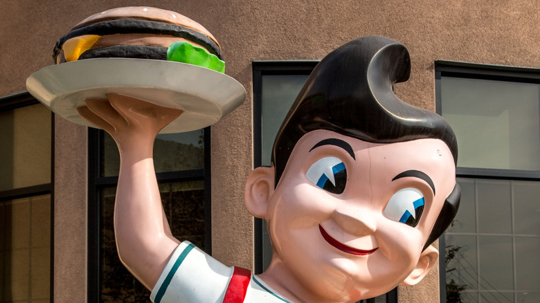 Big Boy statue holding burger