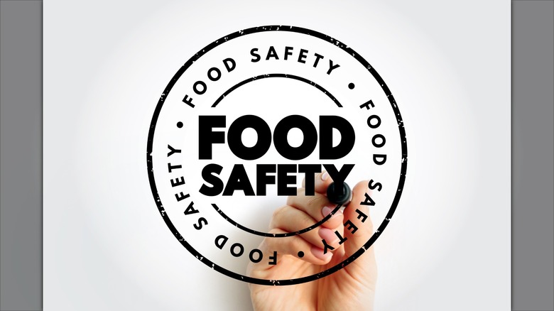 Food safety - scientific method describing handling, preparation, and storage of food in ways that prevent food-borne illness, text stamp concept
